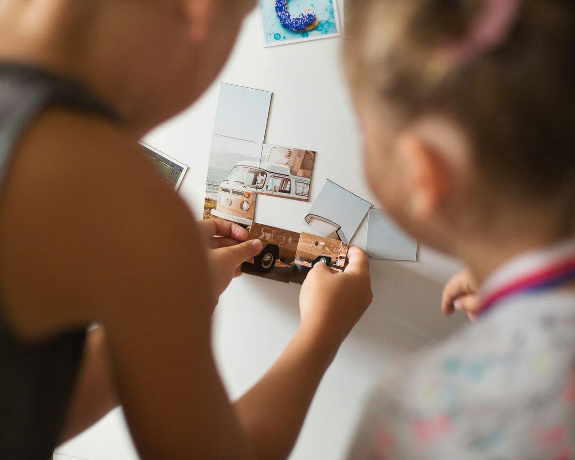 Two girls playing with home made magnets