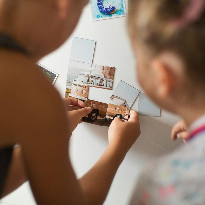 Two girls playing with home made magnets